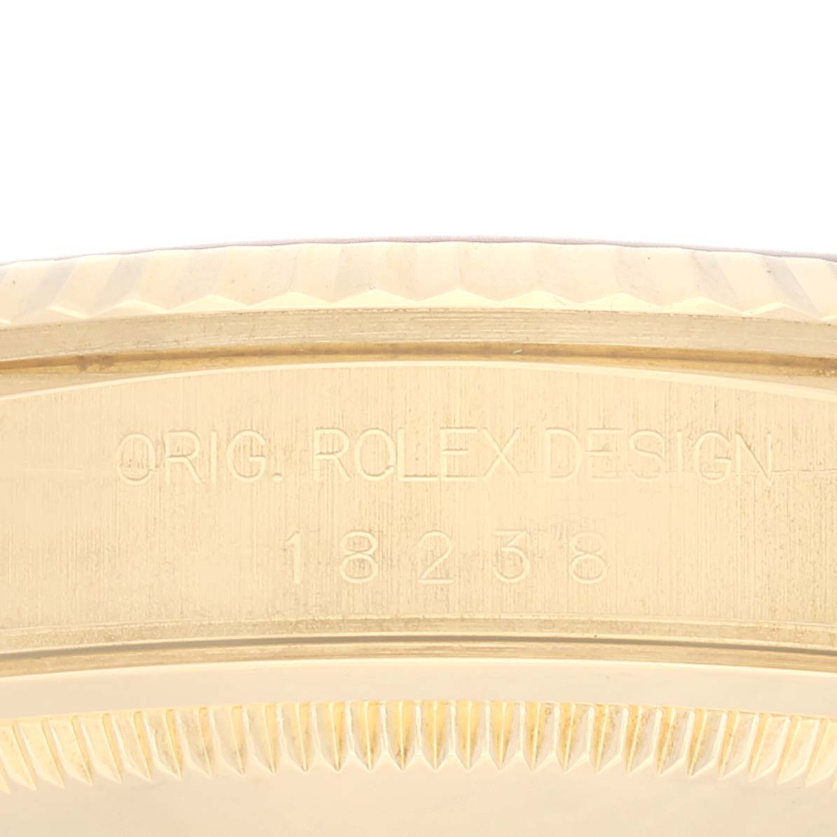 This is a close-up angle showing the engraved serial or model number on the case of the Rolex President 18238 Men
s Yellow Gold Champagne Dial 18238 Men
s Yellow Gold Champagne Dial watch.