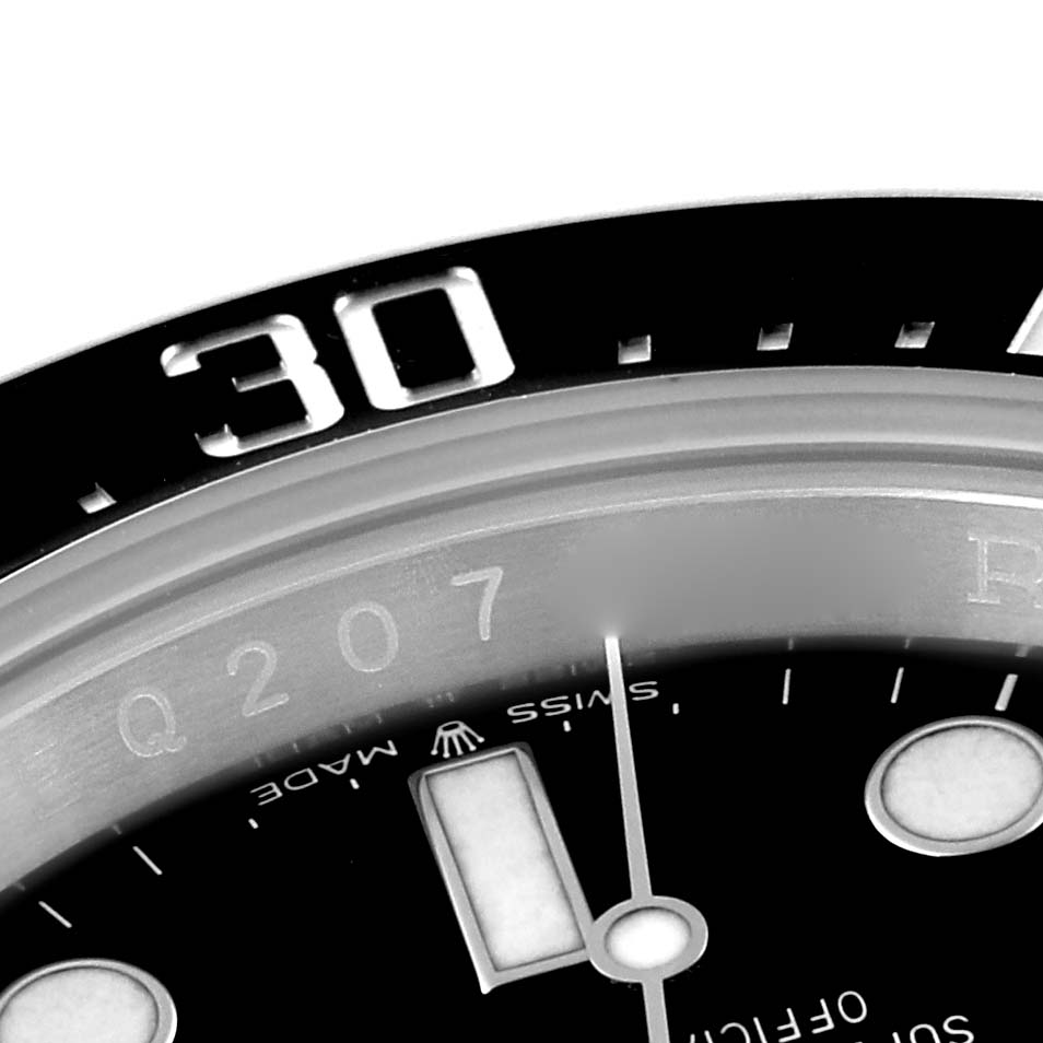This image shows a close-up of the bezel and part of the dial of a Rolex Sea-Dweller 126600 Men
s Stainless Steel Black Dial 126600 Men
s Stainless Steel Black Dial watch.