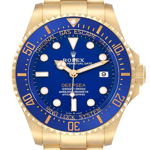The Rolex Sea-Dweller 136668LB Men's Yellow Gold Blue Dial is shown from the front, highlighting the bezel, blue dial, hands, and date window.
