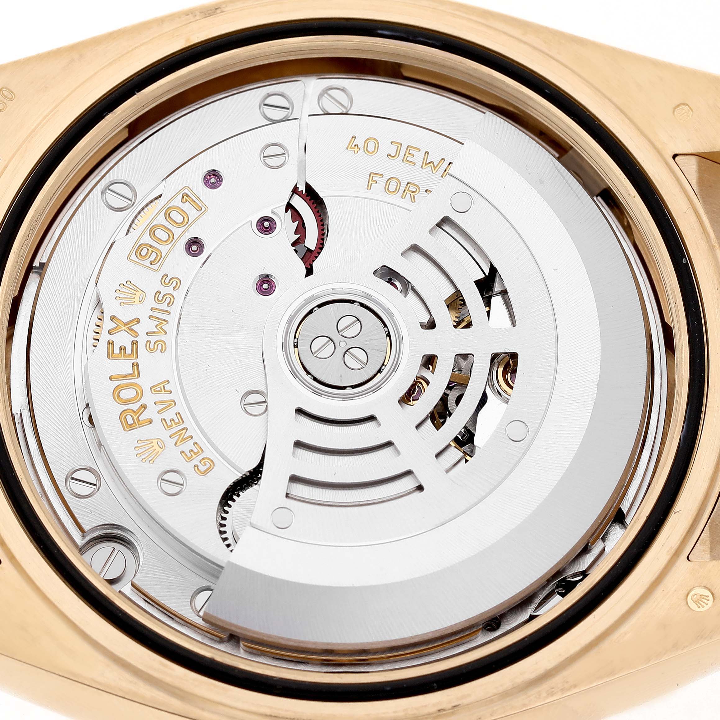 This image shows the movement of a Rolex Sky-Dweller 326238 Men's Yellow Gold White Dial, viewed from the back, highlighting the intricate mechanics inside.