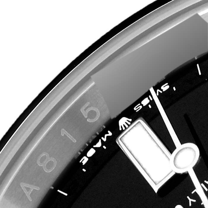 This image shows a close-up view of part of the bezel and dial of a Rolex Submariner 126610 Men
s Stainless Steel Black Dial 126610 Men
s Stainless Steel Black Dial watch.