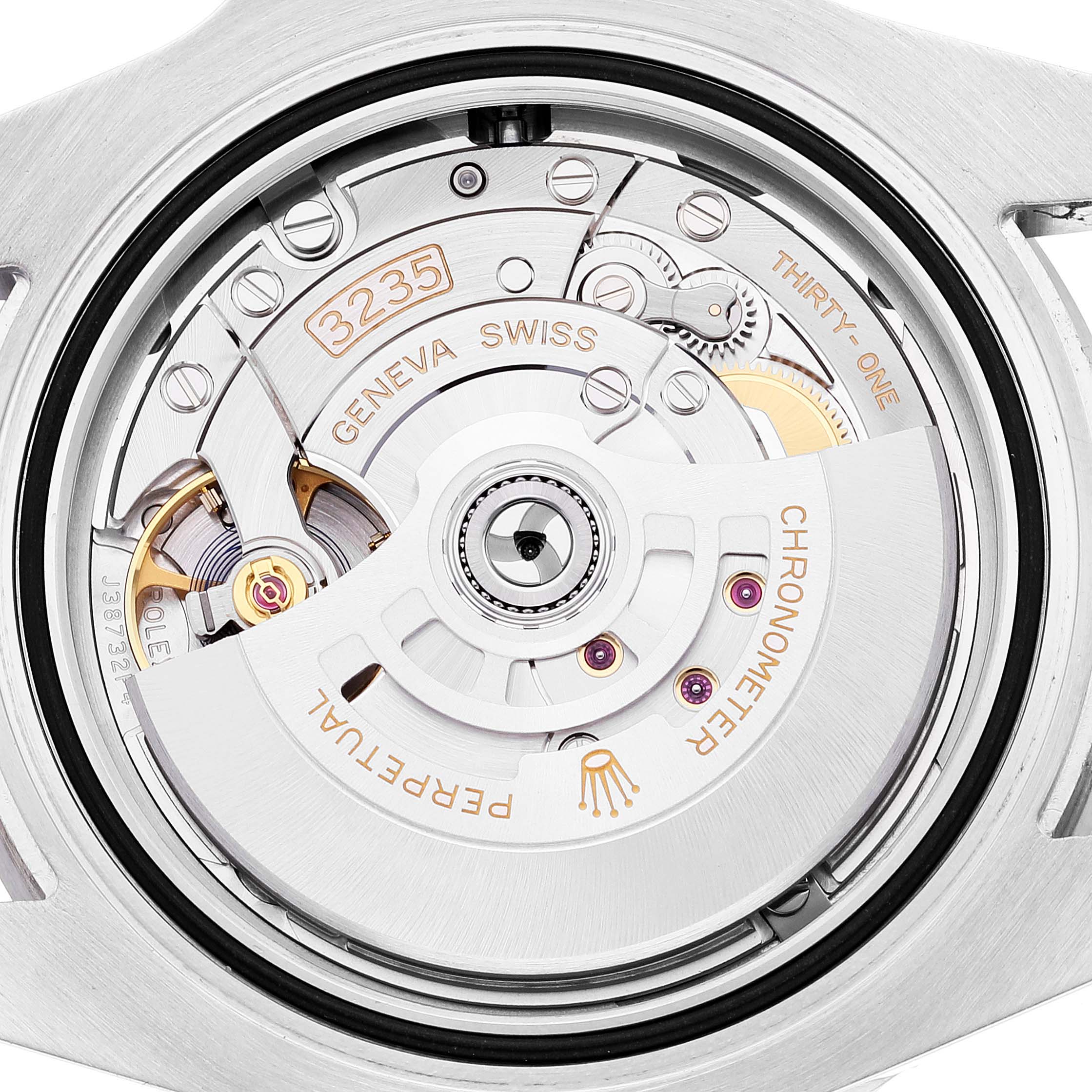 This image shows the movement mechanism of a Rolex Submariner 126610 Men
s Stainless Steel Black Dial 126610 Men
s Stainless Steel Black Dial watch from a close-up, internal angle.