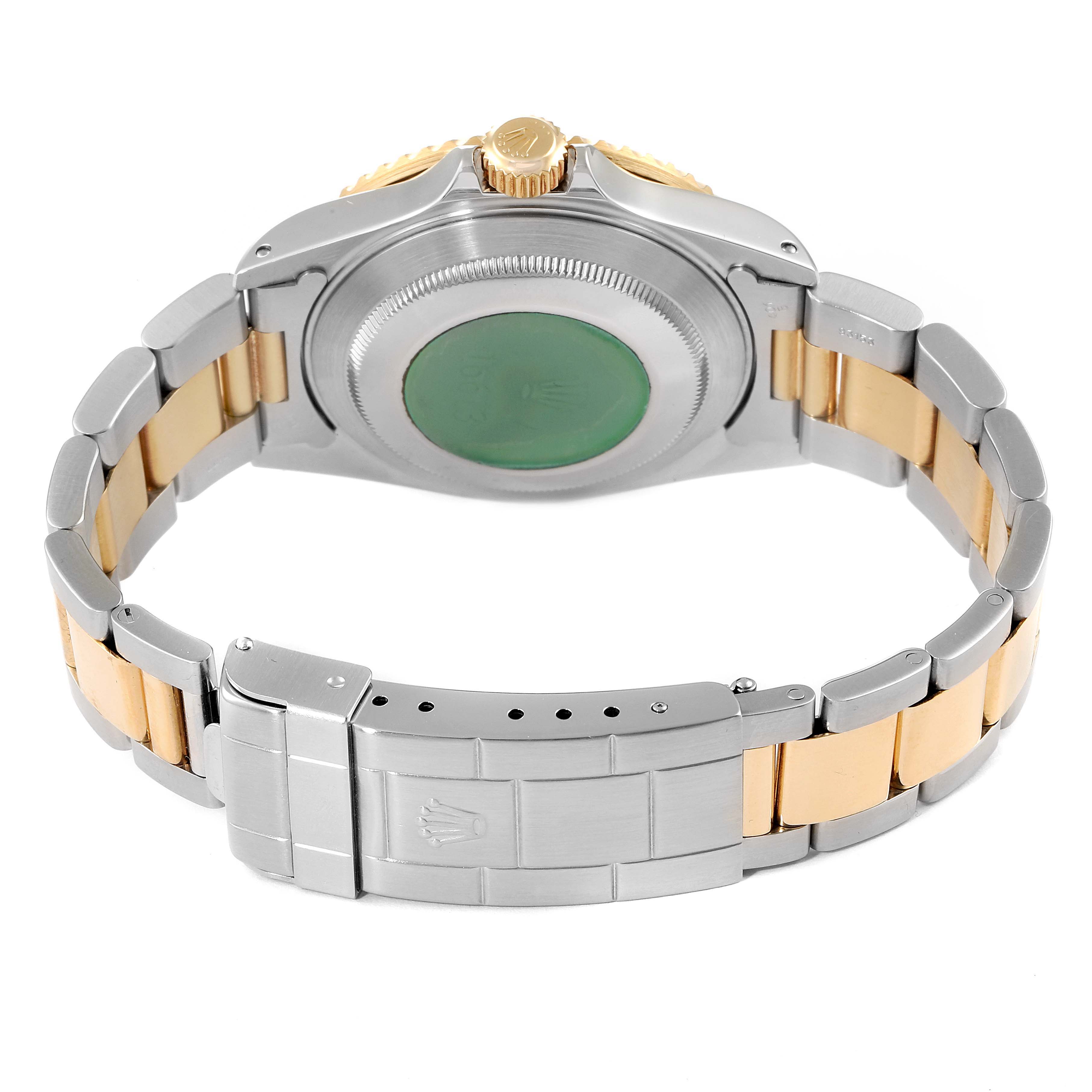 The image shows the case back and bracelet of a Rolex Submariner 16613 Men's Steel and Gold (two tone) Blue Dial 16613 Men's Steel and Gold (two tone) Blue Dial, highlighting the clasp and two-tone metal design.