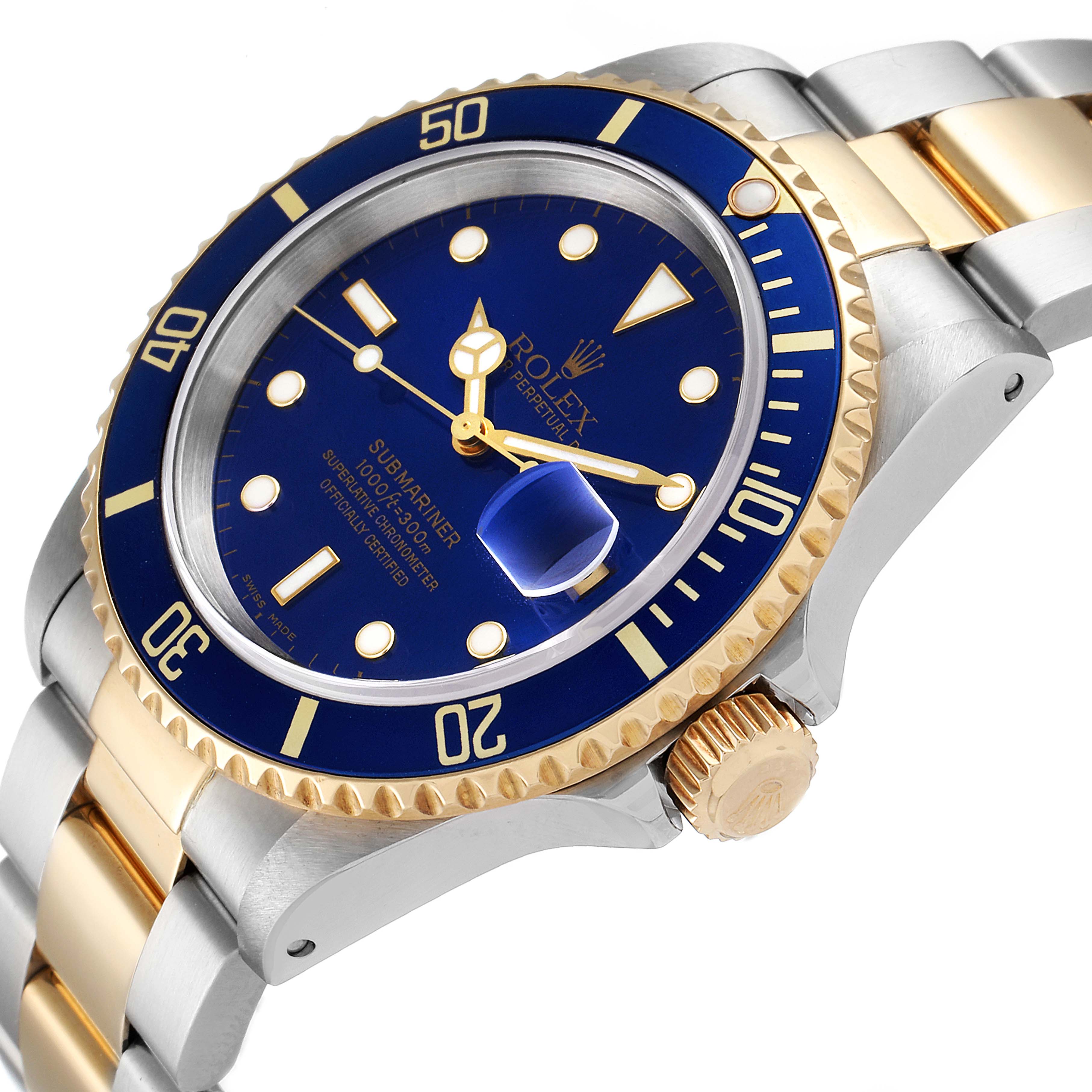 This image shows a close-up of the face, bezel, and part of the bracelet of a Rolex Submariner 16613 Men's Steel and Gold (two tone) Blue Dial 16613 Men's Steel and Gold (two tone) Blue Dial watch.