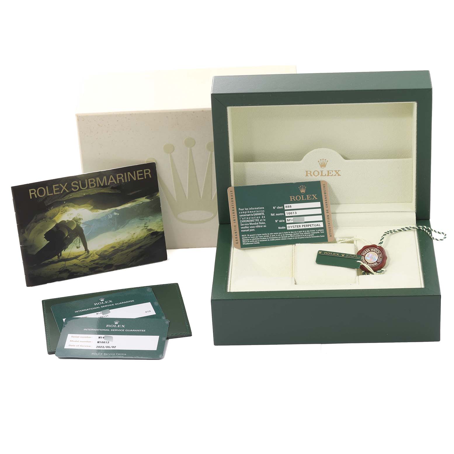 The image shows the packaging, warranty cards, booklet, and accessories for a Rolex Submariner 16613 Men's Steel and Gold (two tone) Blue Dial 16613 Men's Steel and Gold (two tone) Blue Dial model.