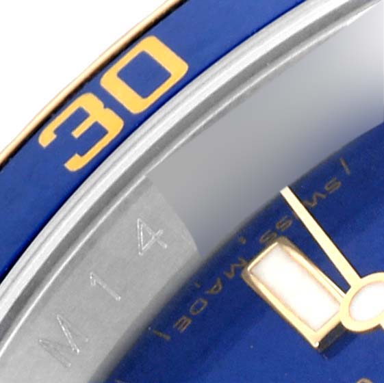 This close-up angle shows the blue bezel with the "30" marker and part of the dial and hands of the Rolex Submariner 16613 Men's Steel and Gold (two tone) Blue Dial 16613 Men's Steel and Gold (two tone) Blue Dial.