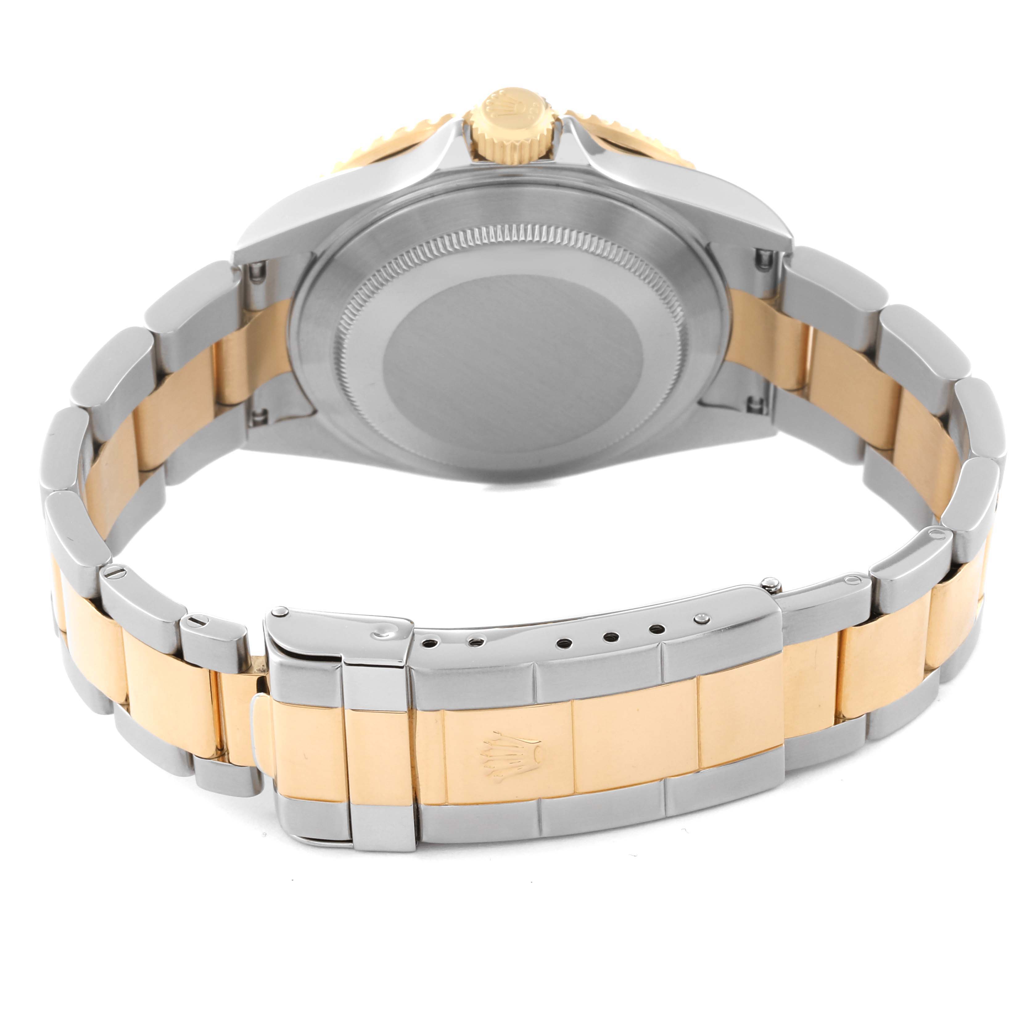 This image shows the back and bracelet of a Rolex Submariner 16613 Men's Steel and Gold (two tone) Blue Dial 16613 Men's Steel and Gold (two tone) Blue Dial, including the clasp and case back.