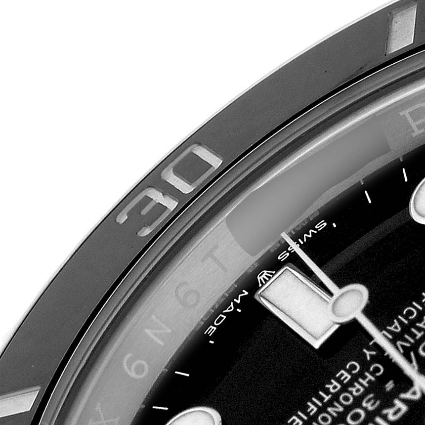 The image shows a close-up of the bezel and dial of a Rolex Submariner 126610LN Men's Stainless Steel Black Dial, highlighting the 30-minute mark and part of the hands.