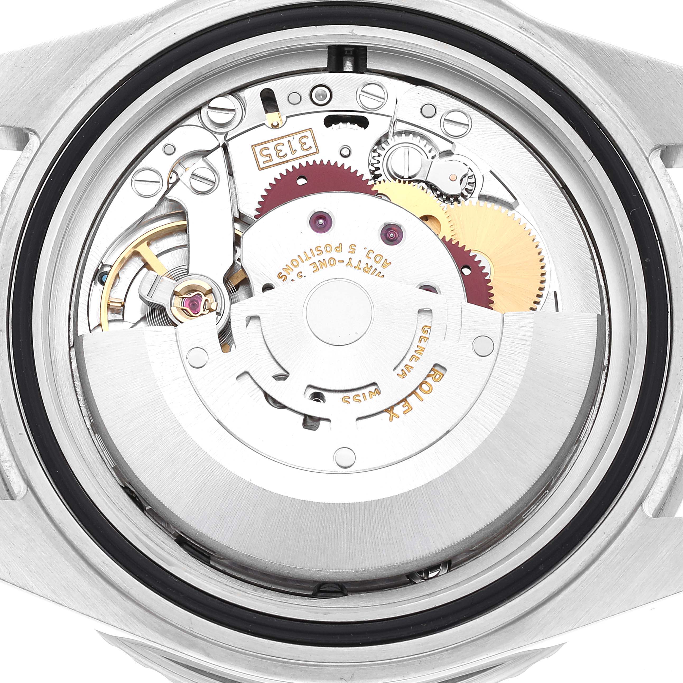The image shows the movement and inner mechanisms of a Rolex Submariner 16610 Men
s Stainless Steel Black Dial 16610 Men
s Stainless Steel Black Dial watch from a close-up, back angle.