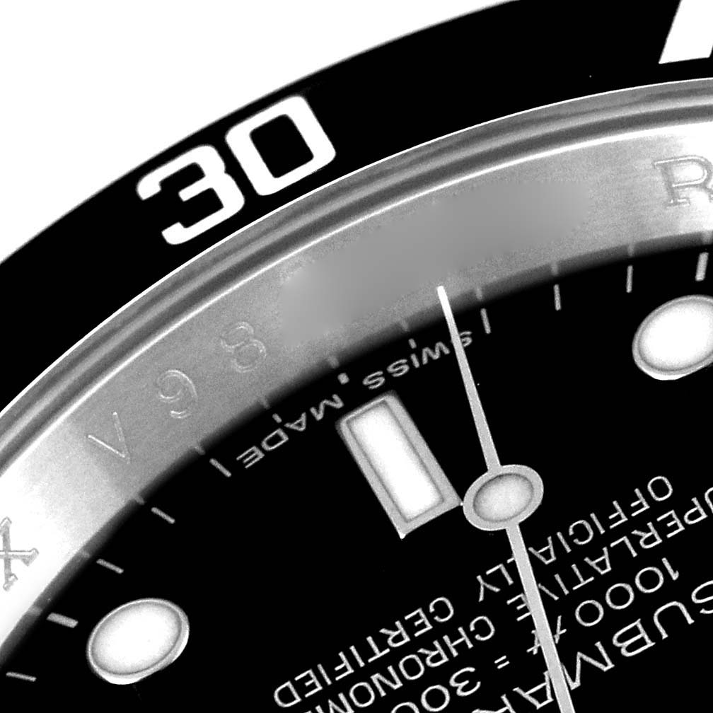 The image shows a close-up of the dial and bezel of a Rolex Submariner 16610 Men
s Stainless Steel Black Dial 16610 Men
s Stainless Steel Black Dial, highlighting the 30-minute marker.