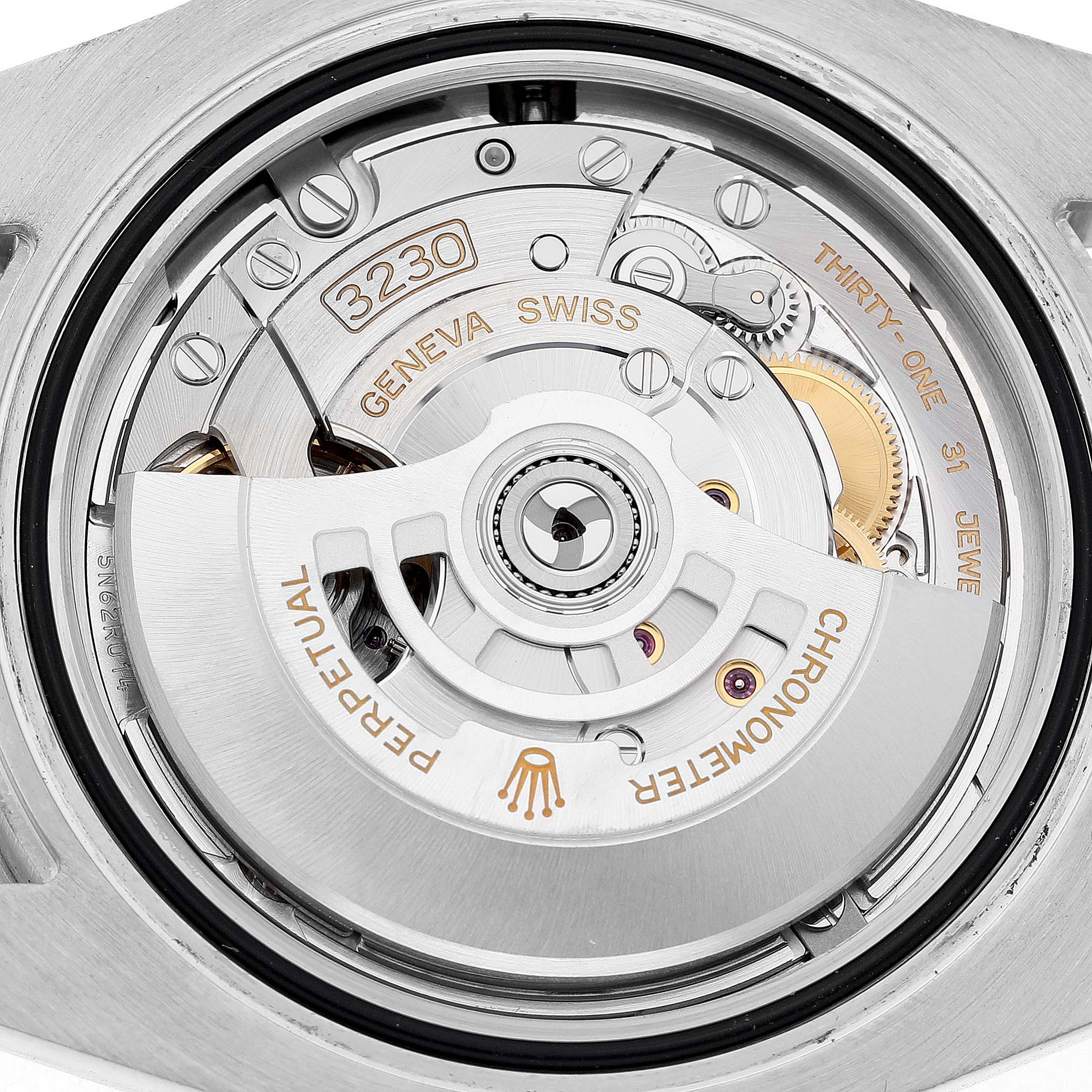 The image shows the Rolex Submariner M124060-0001 Men's Stainless Steel Black Dial's movement, highlighting the rotor and internal components from a rear angle.