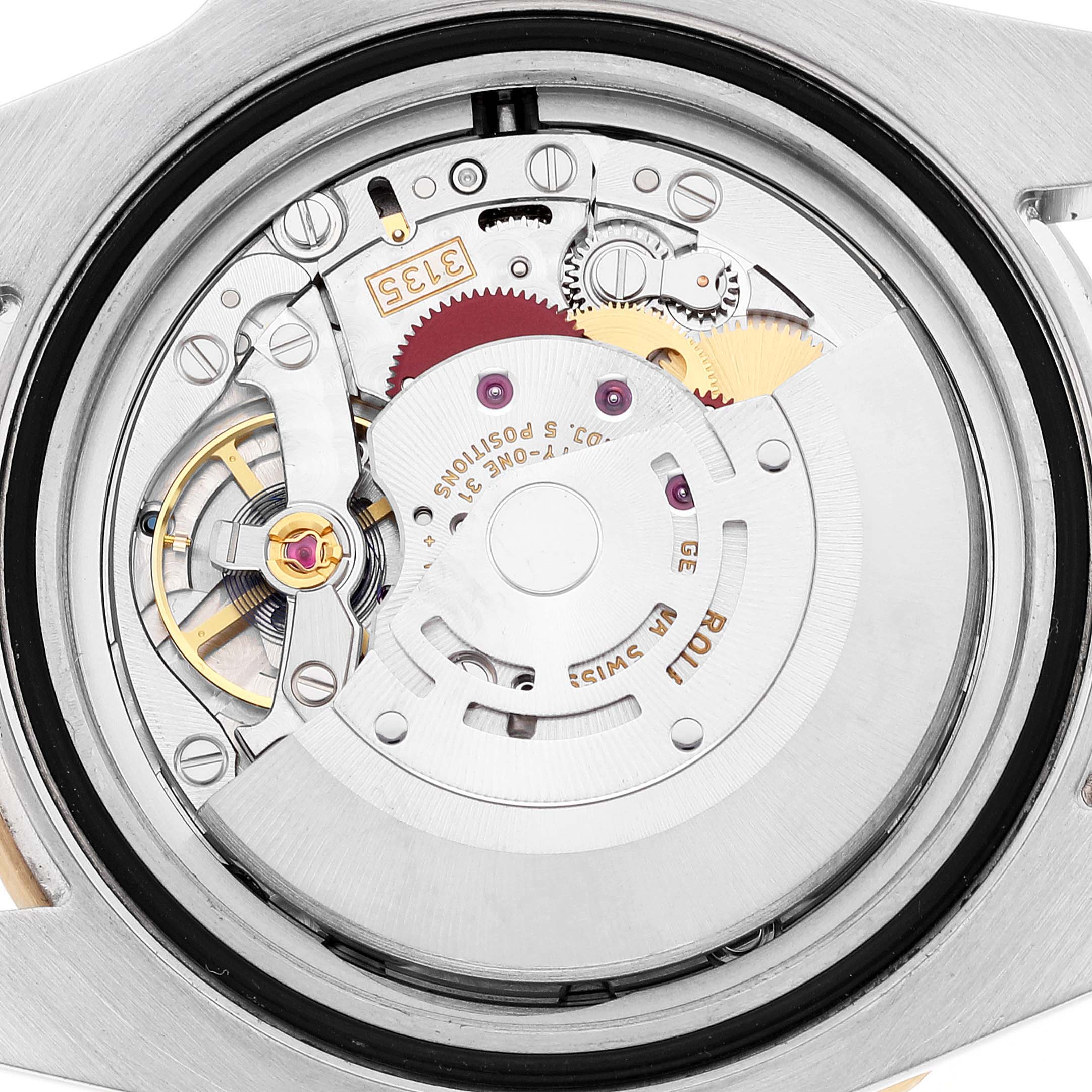 This image shows a close-up view of the movement and internal mechanisms of a Rolex Submariner 116613 Men
s Steel and Gold (two tone) Black Dial 116613 Men
s Steel and Gold (two tone) Black Dial watch.