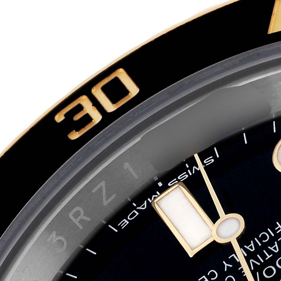 This image shows a close-up of the bezel and dial of a Rolex Submariner 116613 Men
s Steel and Gold (two tone) Black Dial 116613 Men
s Steel and Gold (two tone) Black Dial watch, highlighting the 
30
 marker and part of the 
Swiss Made
 text.