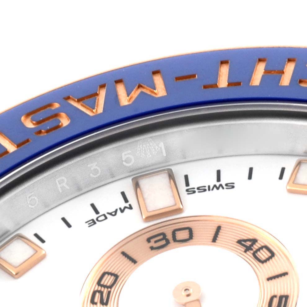 Close-up view of the Rolex Yacht-Master 116681 Men's Steel and Gold (two tone) White Dial 116681 Men's Steel and Gold (two tone) White Dial dial, focusing on the upper bezel, markers, and part of the seconds ring.