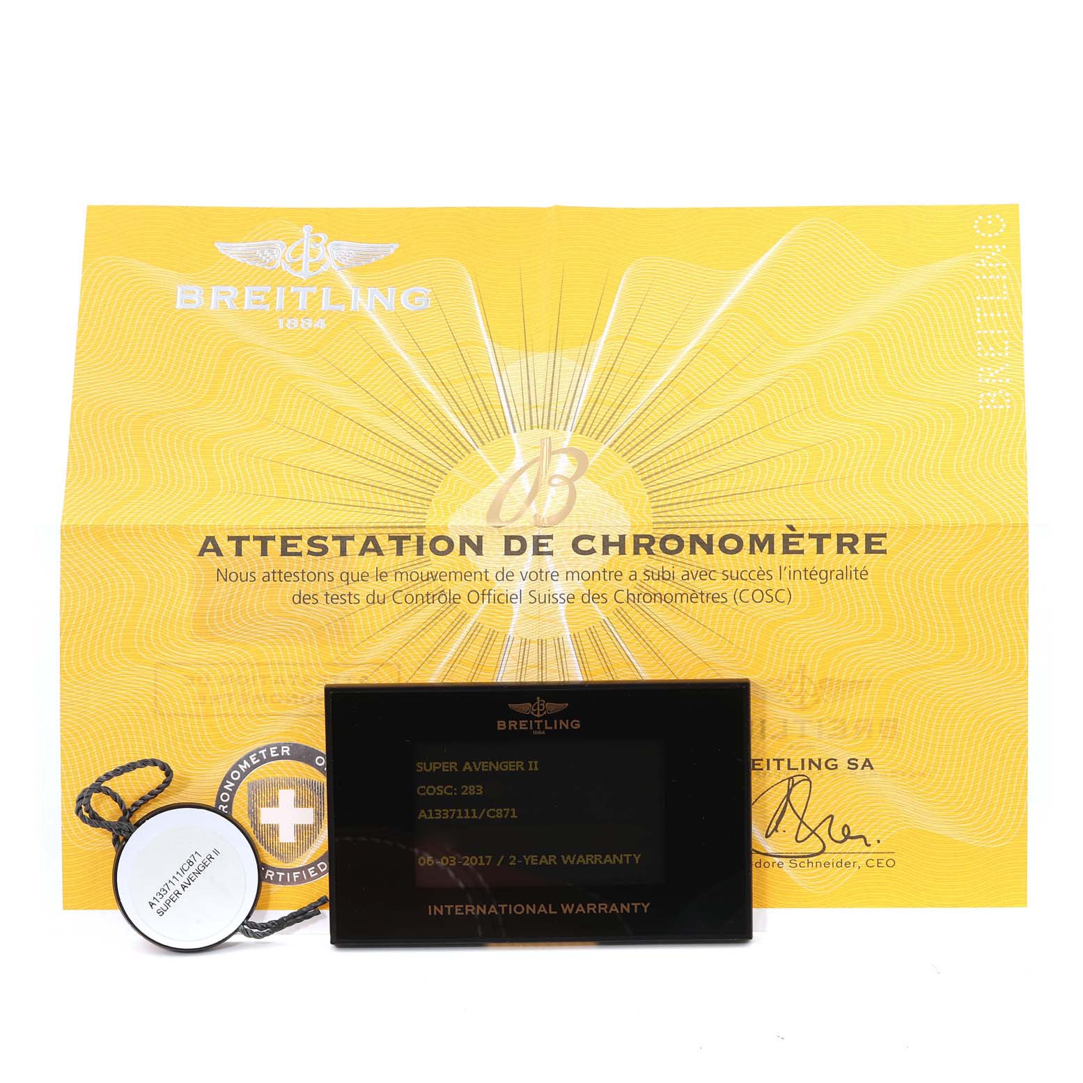 The image shows the warranty card, certification paper, and a chronometer tag for the Breitling Avenger A13371 Men's Stainless Steel Blue Dial A13371 Men's Stainless Steel Blue Dial model.