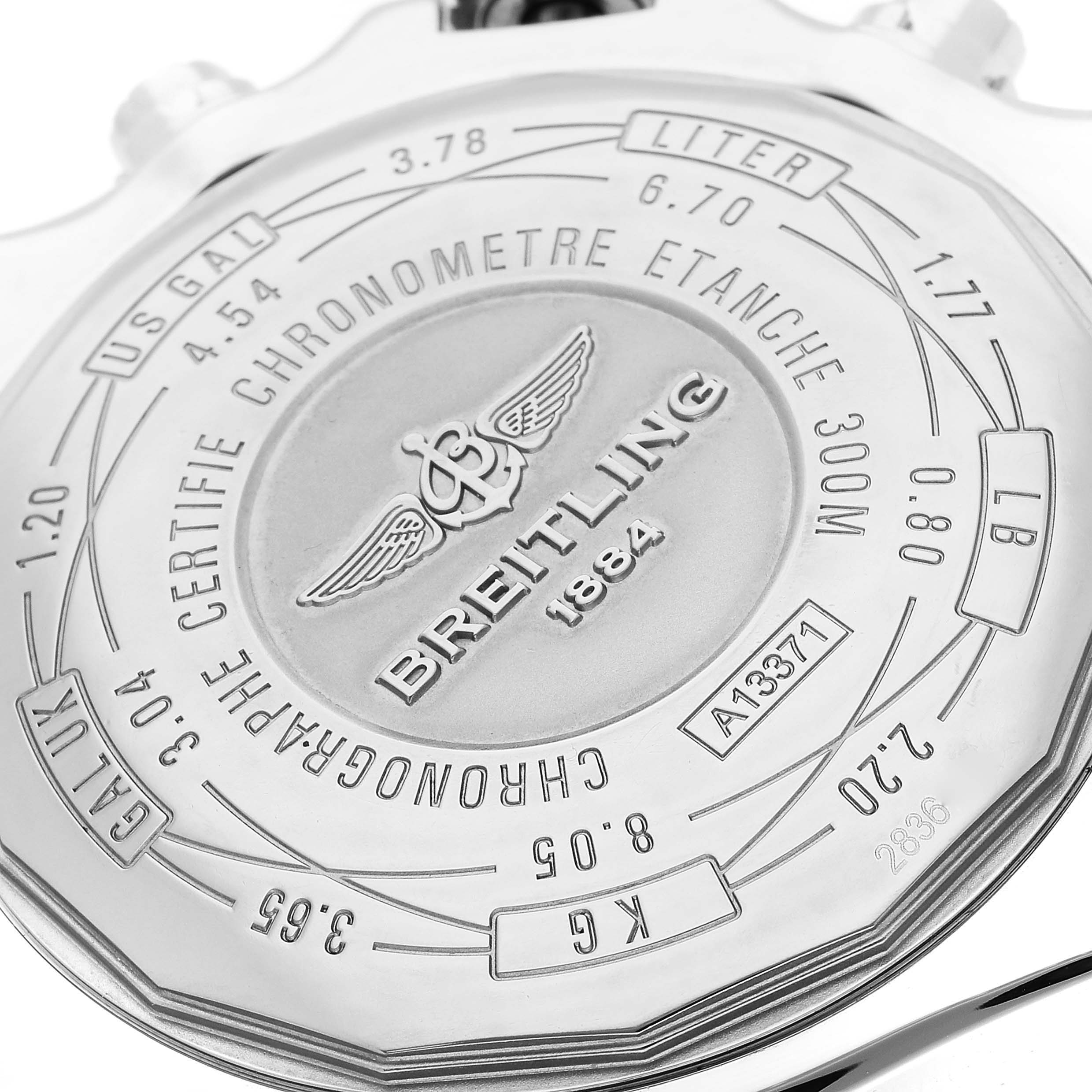 The image shows the case back of a Breitling Avenger A13371 Men's Stainless Steel Blue Dial A13371 Men's Stainless Steel Blue Dial watch, highlighting its branding and specifications.