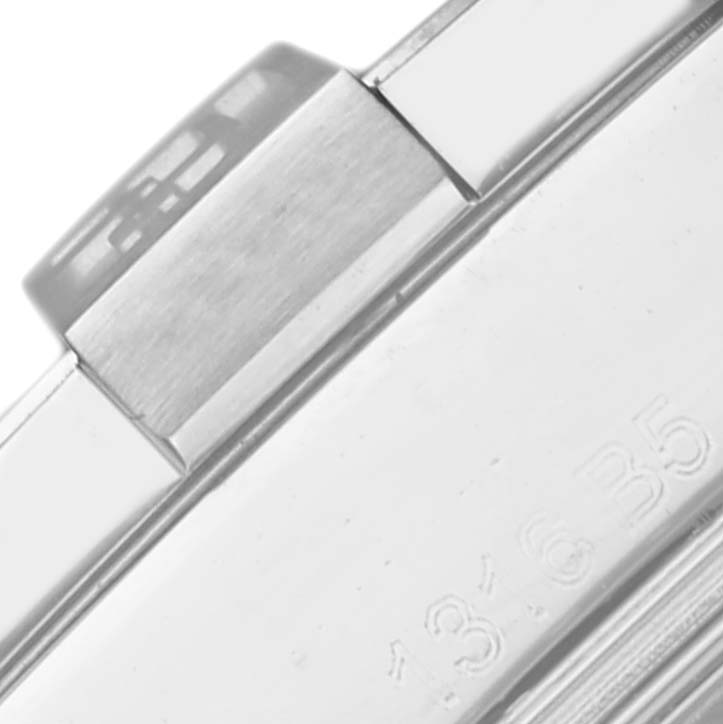 The image shows a close-up side view of the case and bezel of a Breitling Avenger A3239011/C930 Men's Stainless Steel Mother of Pearl Dial A3239011/C930 Men's Stainless Steel Mother of Pearl Dial watch, highlighting its brushed metal texture.