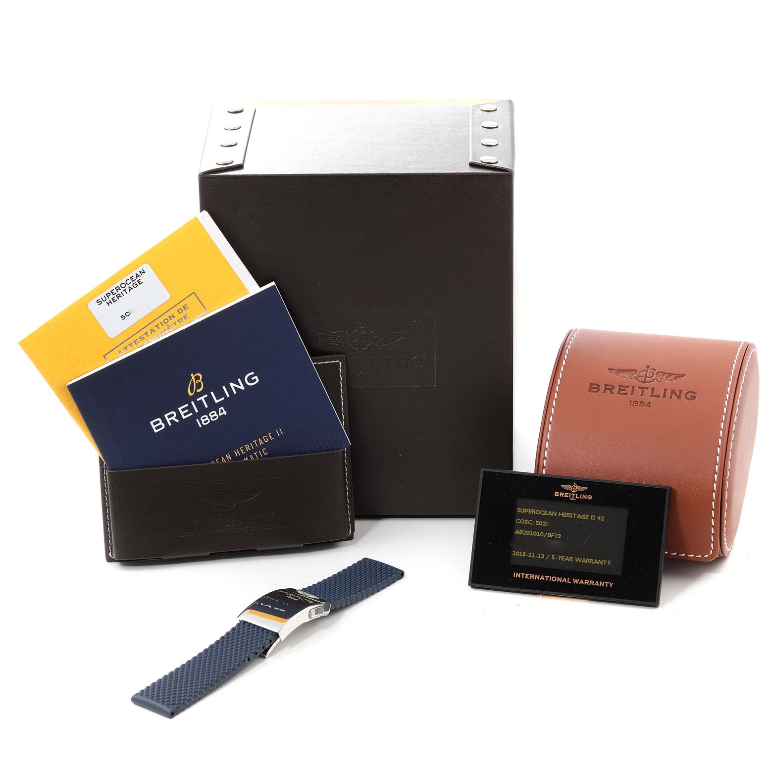 This image shows the Breitling Superocean AB2010 Men's Stainless Steel Black Dial AB2010 Men's Stainless Steel Black Dial model watch and its accessories, including manuals, warranty card, and boxes from a front angle.