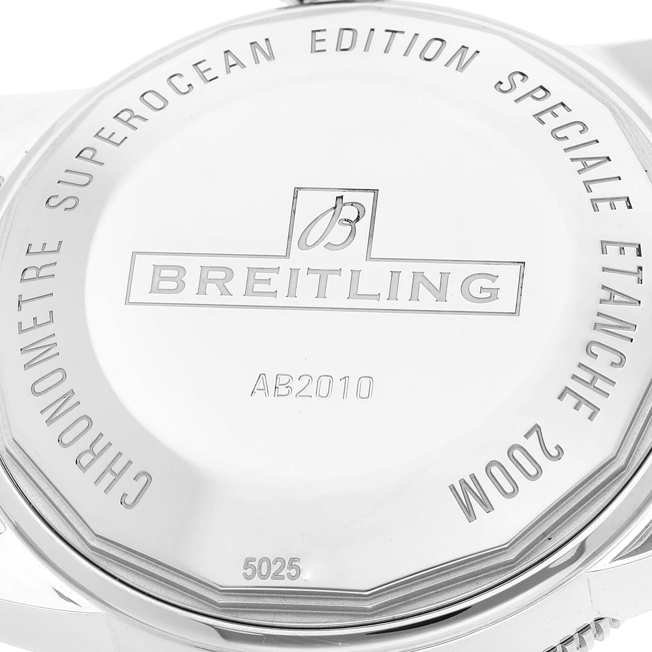 The image shows the back case of a Breitling Superocean AB2010 Men's Stainless Steel Black Dial AB2010 Men's Stainless Steel Black Dial watch, featuring engravings and branding details.