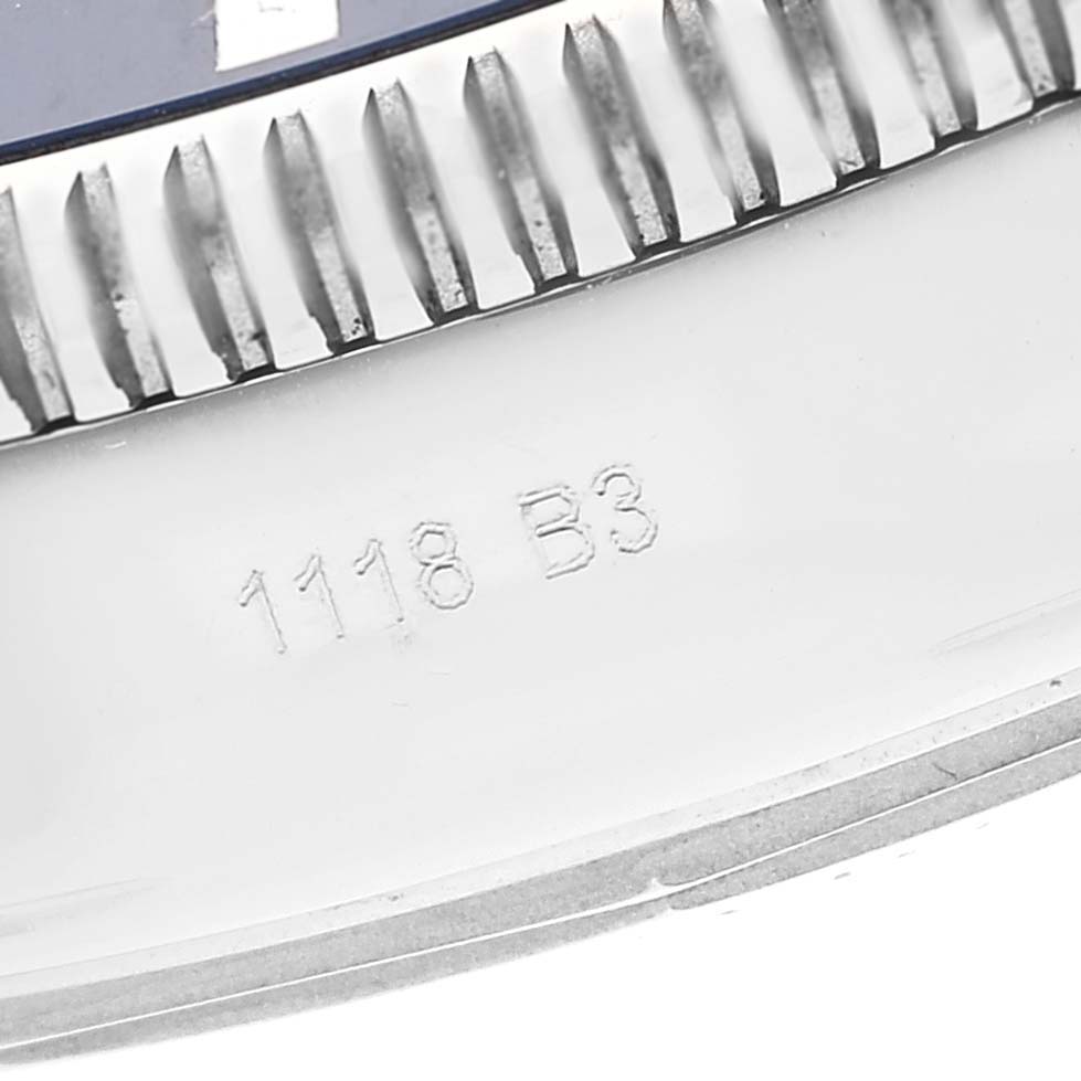 This close-up image shows the engraved bezel and part of the case of a Breitling Superocean AB2010 Men's Stainless Steel Black Dial AB2010 Men's Stainless Steel Black Dial watch.