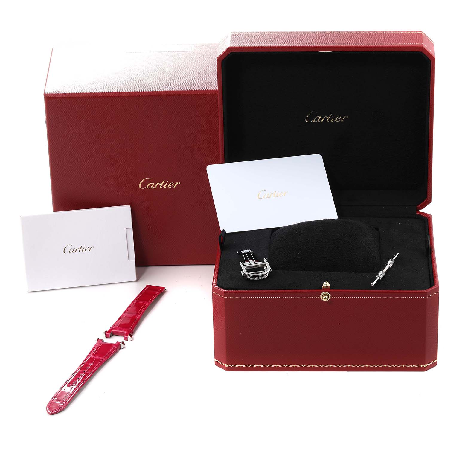 The image shows a Cartier Pasha WSPA0021 Women
s Stainless Steel Silver Dial WSPA0021 Women
s Stainless Steel Silver Dial watch box, an extra strap, buckle, and a tool kit from a front angle.