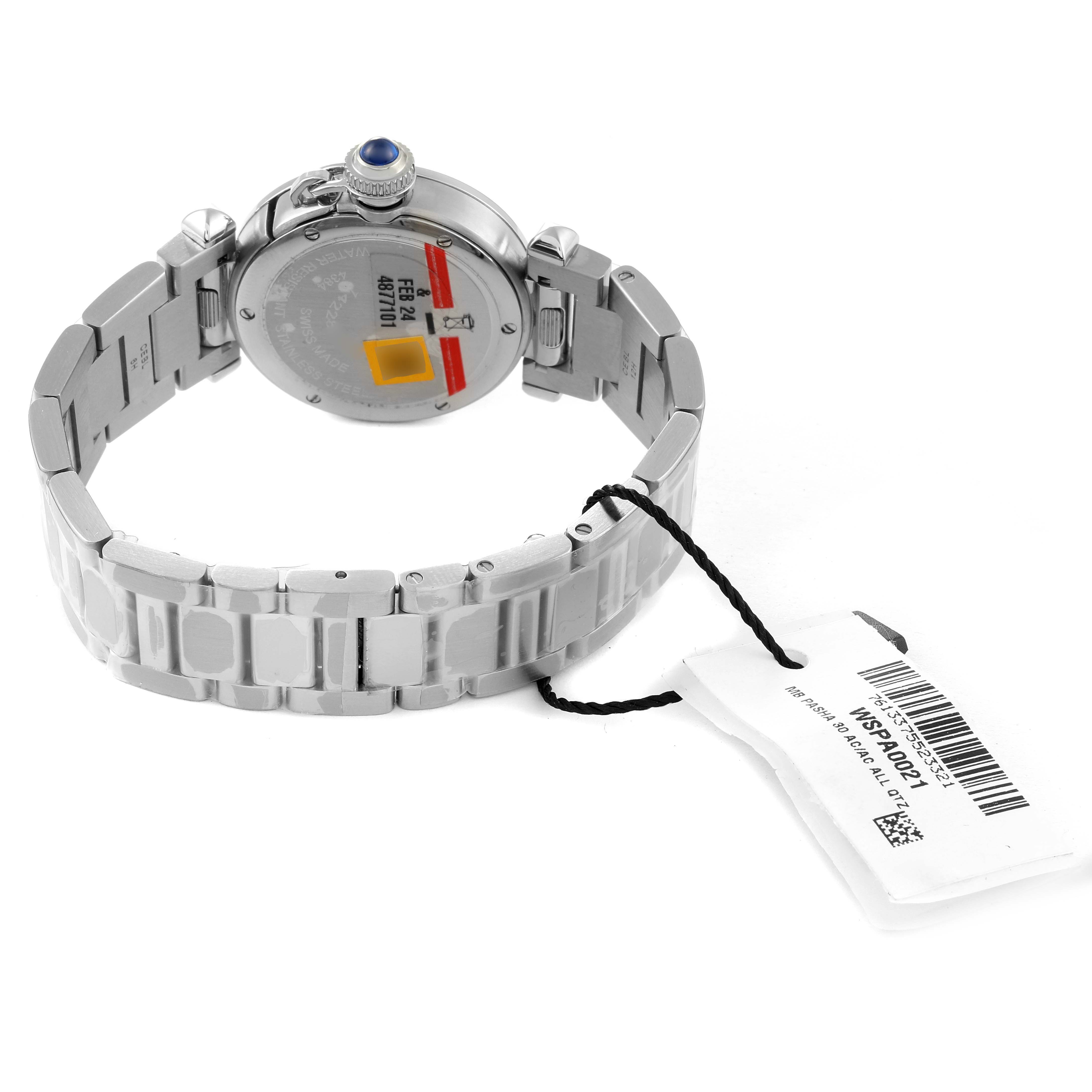 The image shows the back and bracelet of a Cartier Pasha WSPA0021 Women
s Stainless Steel Silver Dial WSPA0021 Women
s Stainless Steel Silver Dial model watch, including the case back and tag.