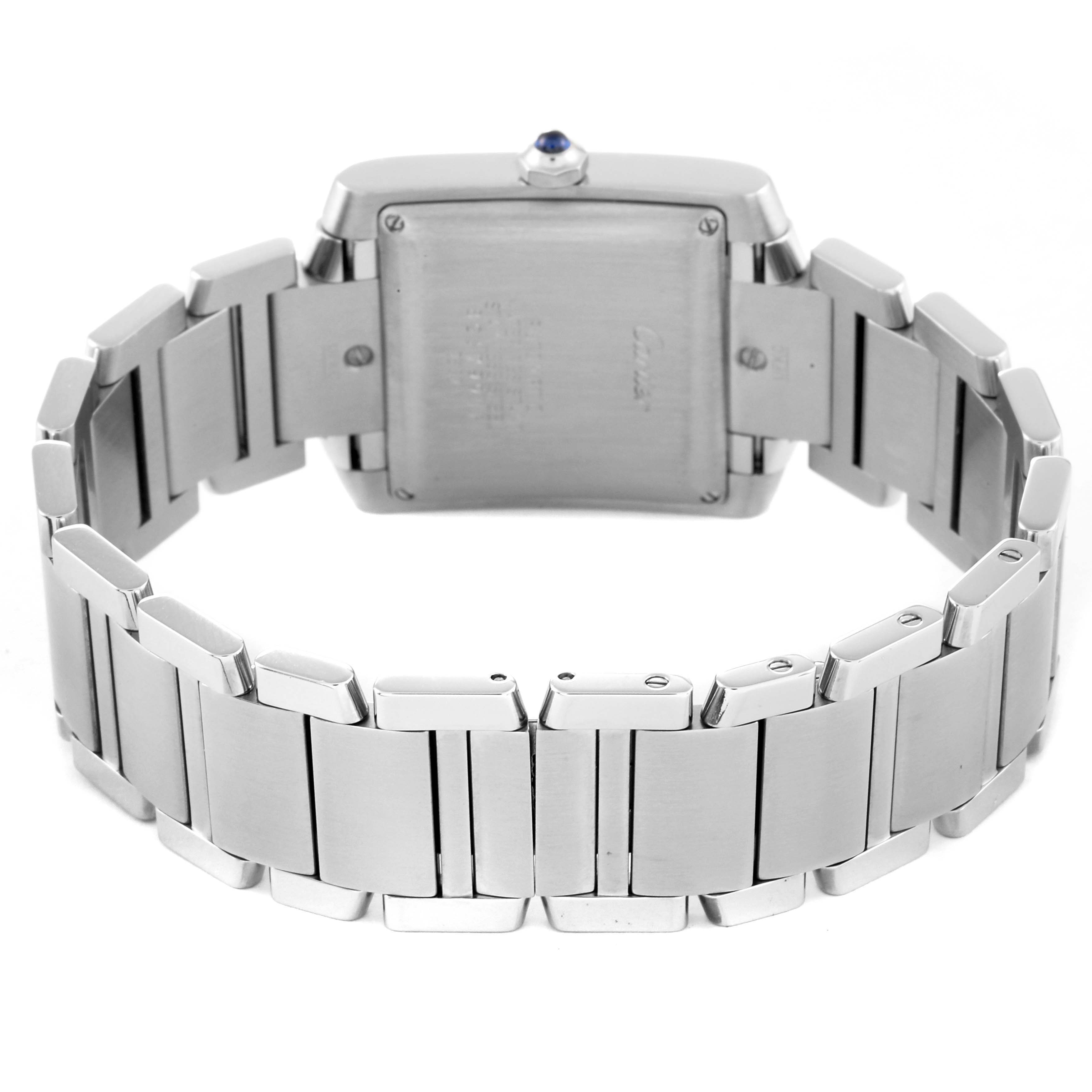 The image shows the back and bracelet of a Cartier Tank Française watch, highlighting the clasp and case back.