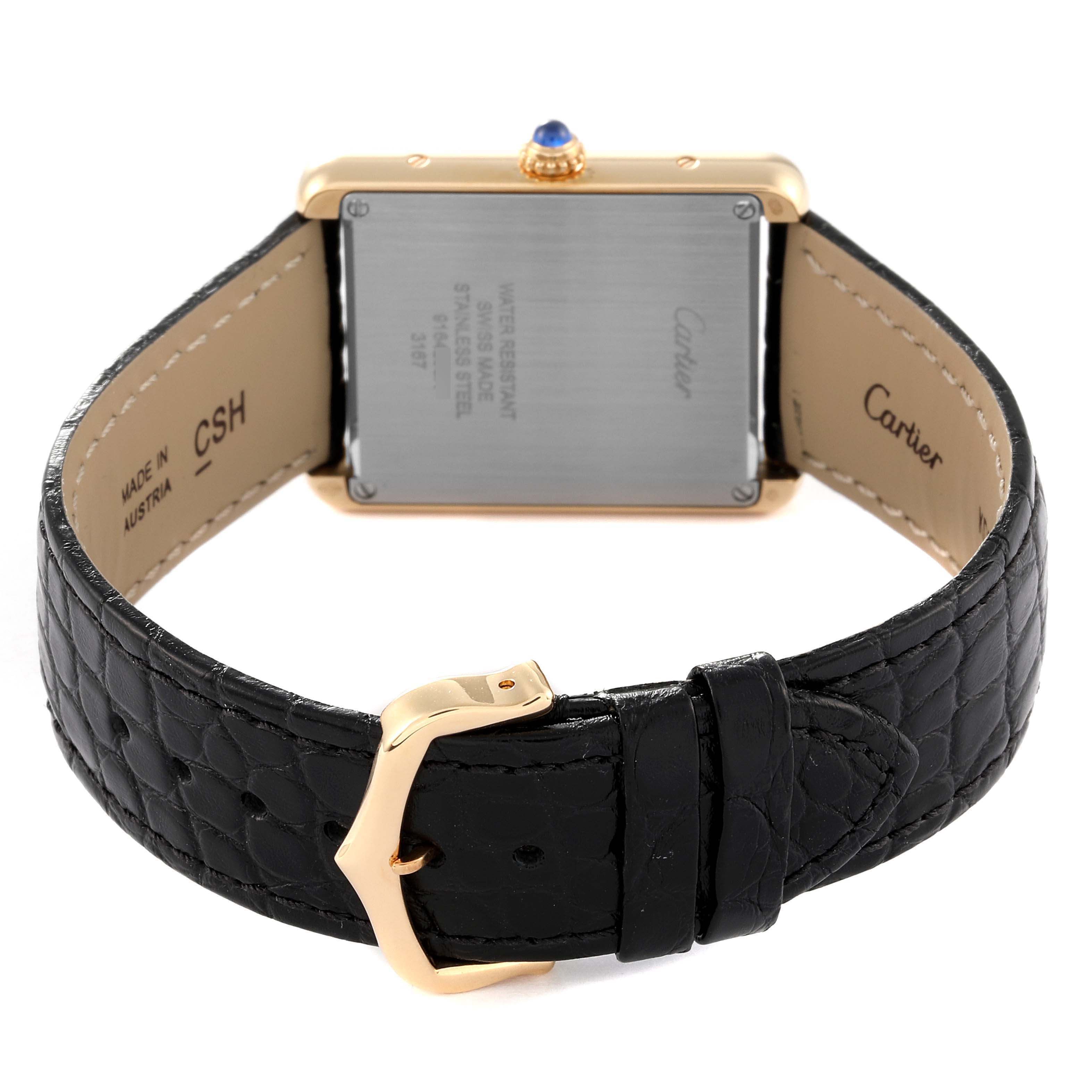 The image displays the back view of a Cartier Tank Solo W5200004 Men
s Yellow Gold Silver Dial W5200004 Men
s Yellow Gold Silver Dial watch, highlighting the case back and black leather strap with a gold buckle.