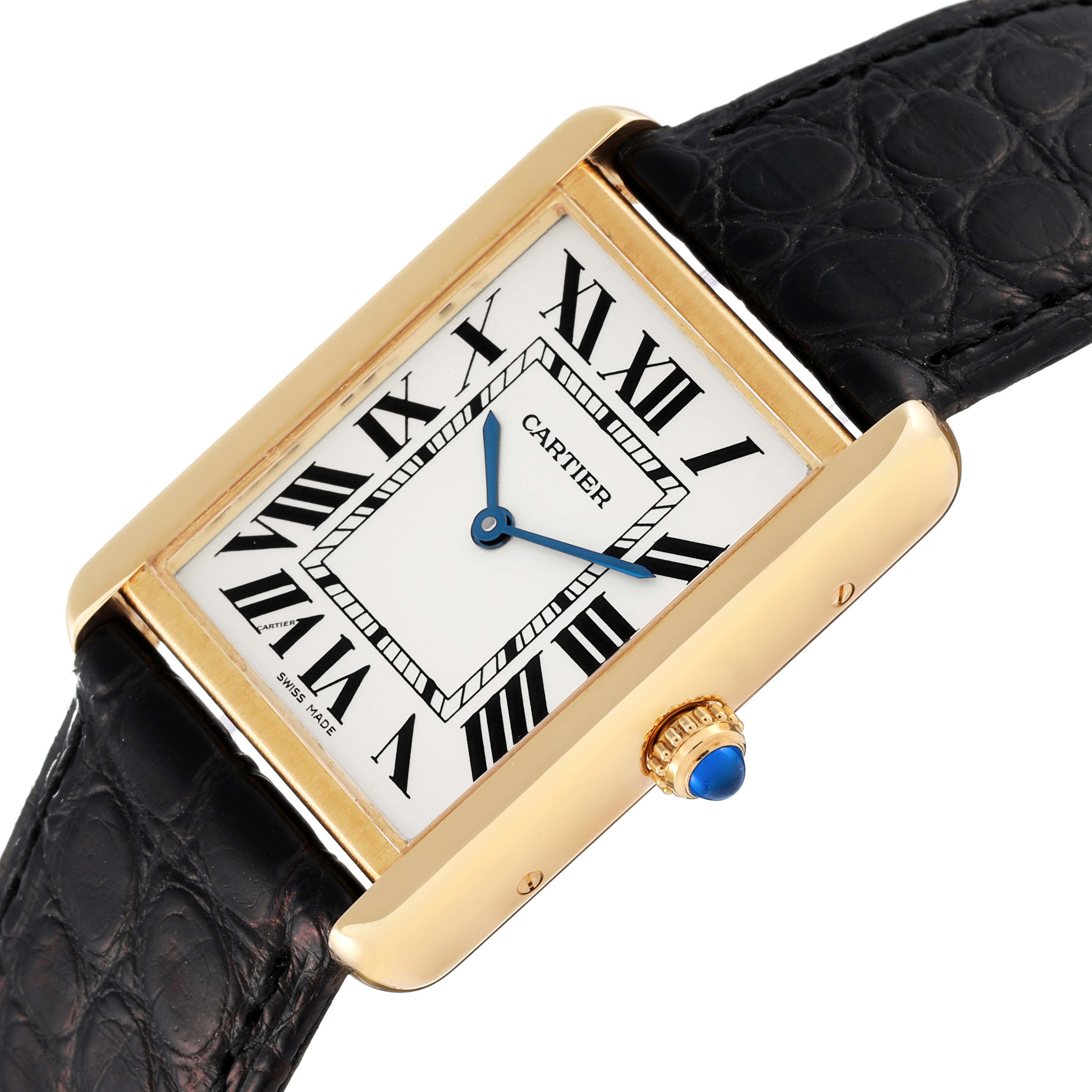 The image shows a Cartier Tank Solo W5200004 Men
s Yellow Gold Silver Dial W5200004 Men
s Yellow Gold Silver Dial watch from an angled view, highlighting the dial, black leather strap, gold case, and blue cabochon crown.