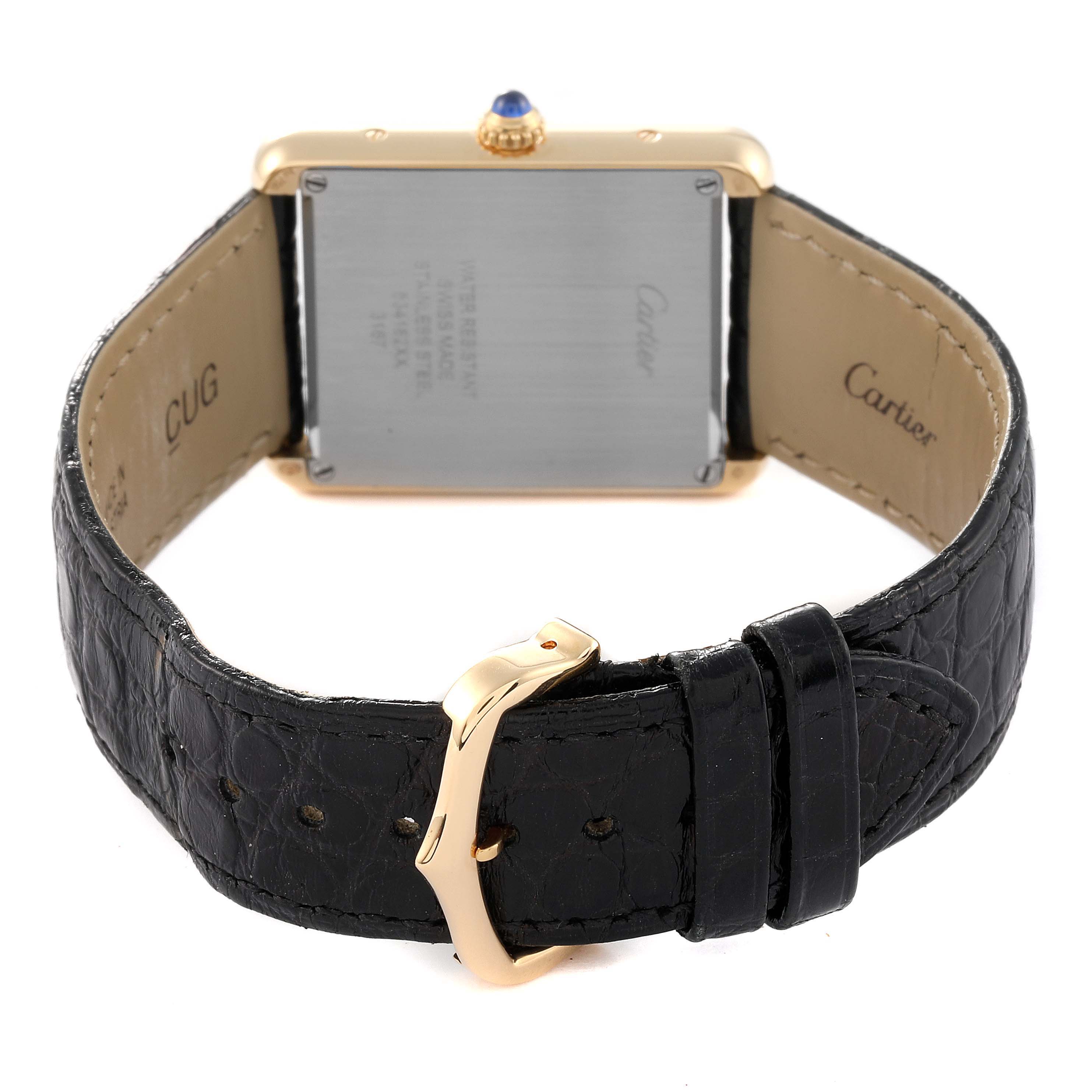 The image shows the back view of a Cartier Tank Solo W5200004 Men
s Yellow Gold Silver Dial W5200004 Men
s Yellow Gold Silver Dial watch, highlighting its band, buckle, and case back.