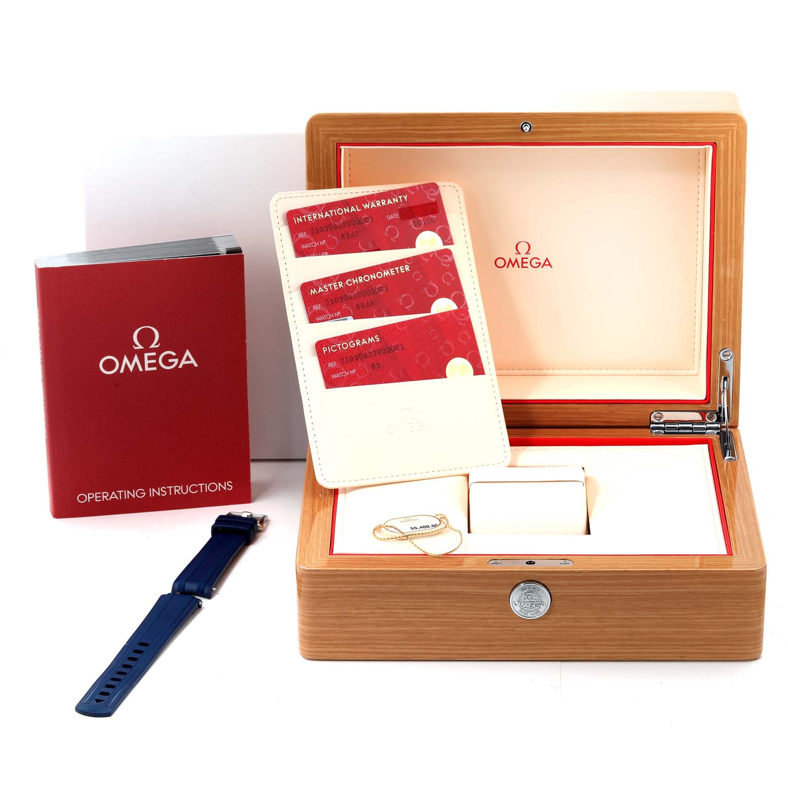 The image shows an Omega Seamaster 210.30.42.20.03.001 Men's Stainless Steel Blue Dial 210.30.42.20.03.001 Men's Stainless Steel Blue Dial watch box, operating instructions, warranty cards, and an extra blue watch strap.