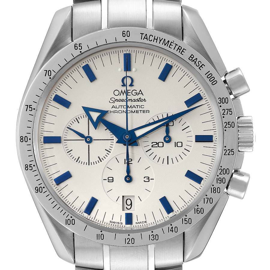 The Omega Speedmaster watch is shown from the front, displaying the dial, subdials, tachymeter bezel, and part of the bracelet.