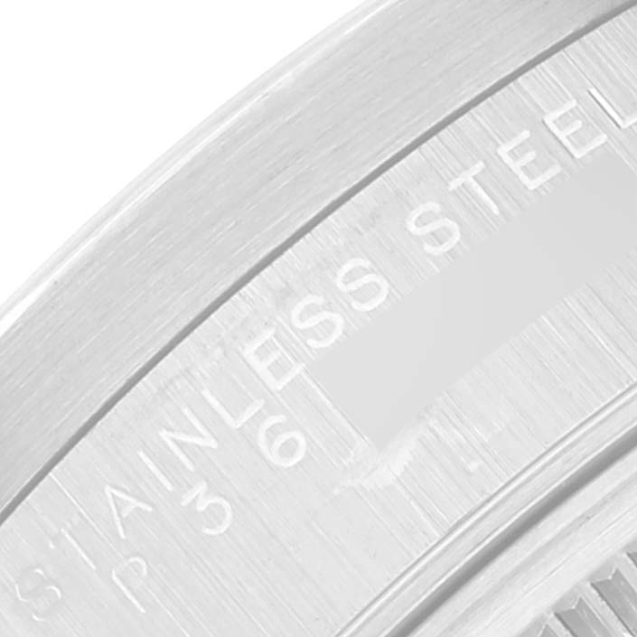 This image shows a close-up of the engraving on the stainless steel case back of a Rolex Date 15210 Men's Stainless Steel Blue Dial 15210 Men's Stainless Steel Blue Dial model watch.