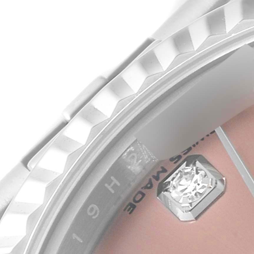 This close-up angle shows the bezel, part of the dial, and a diamond marker of the Rolex Datejust 279174 Women's Stainless Steel Pink Dial 279174 Women's Stainless Steel Pink Dial watch.