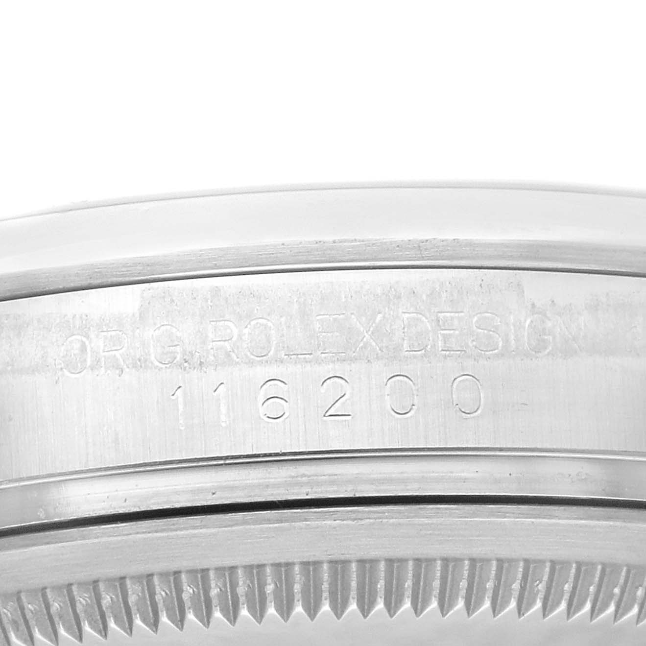 The image shows the side of the Rolex Datejust 116200 Men
s Stainless Steel Black Dial 116200 Men
s Stainless Steel Black Dial watch case, focusing on the engraved model number.