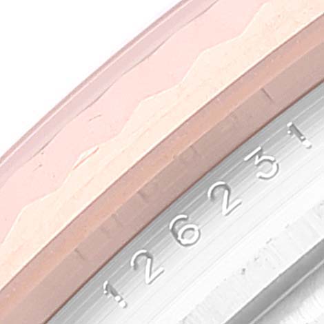 This image shows a close-up of the bezel and part of the case with engraved serial numbers of a Rolex Datejust 126231 Men's Steel and Gold (two tone) Grey Dial 126231 Men's Steel and Gold (two tone) Grey Dial watch.