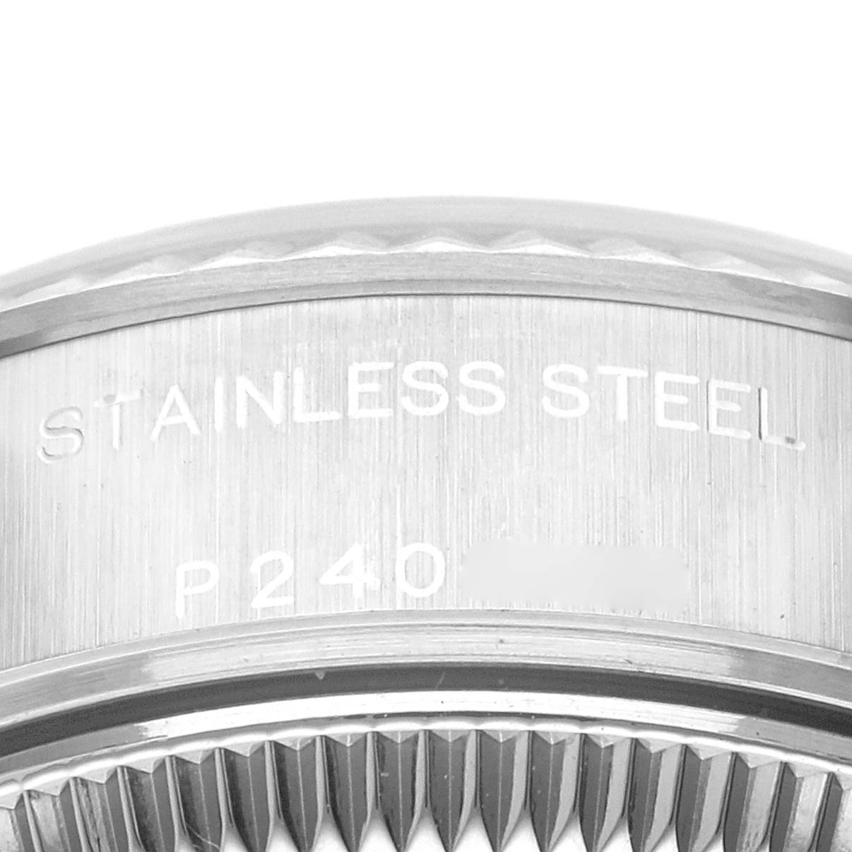 The image shows a close-up of the fluted bezel and engraved text on the side of a Rolex Datejust 79174 Women
s Stainless Steel Blue Dial 79174 Women
s Stainless Steel Blue Dial watch.