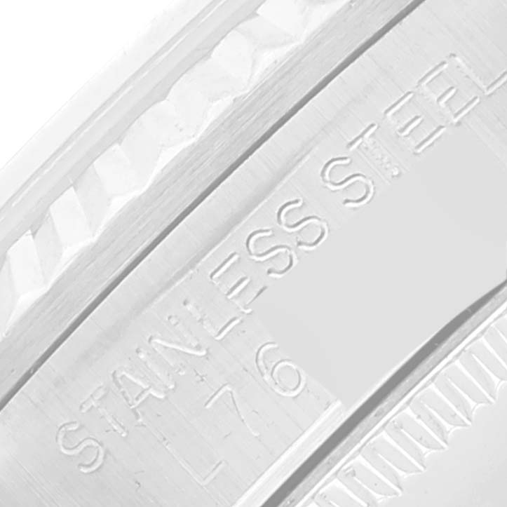 This image shows a close-up of the side engraving on a stainless steel case of a Mid-Size Rolex watch.