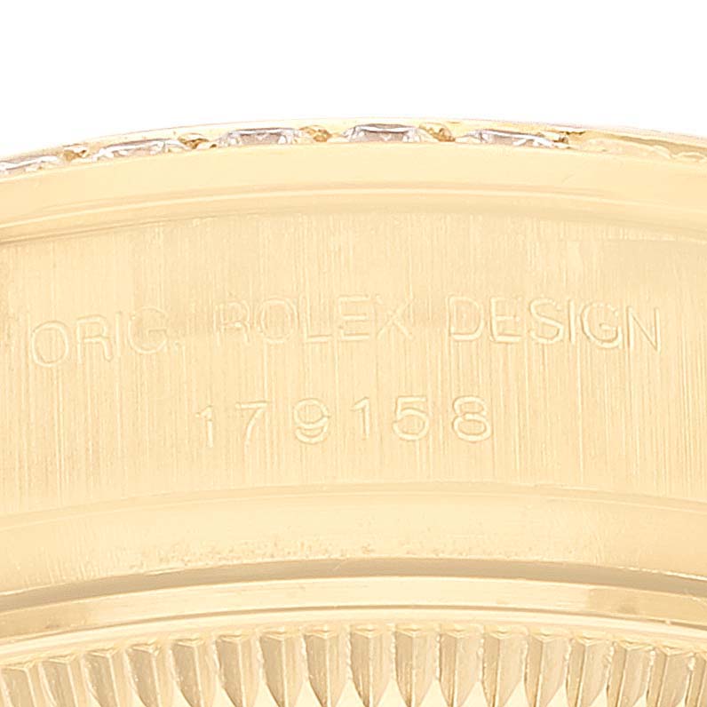 This image shows a close-up of the engraving on the side of the Rolex President 179158 Women's Yellow Gold Champagne Dial 179158 Women's Yellow Gold Champagne Dial watch model.