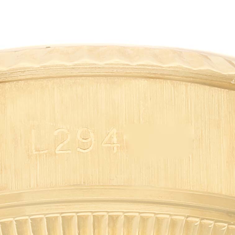 This image shows the side view of the President model Rolex watch, focusing on its engraved serial number.