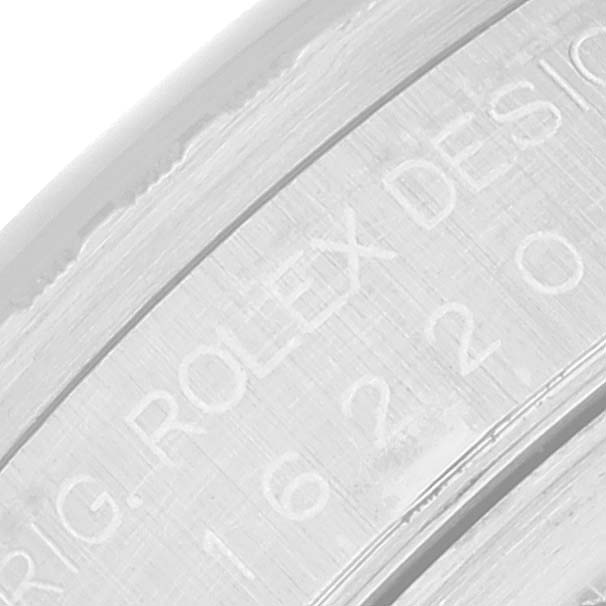 This image shows a close-up of the engraving on the inner bezel of a Rolex Datejust 16220 Men's Stainless Steel Black Dial 16220 Men's Stainless Steel Black Dial watch.