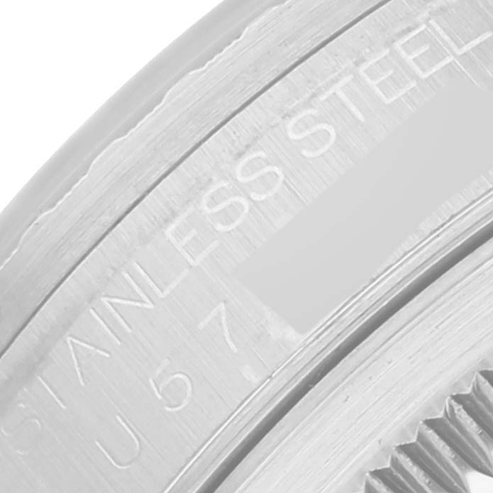 This close-up image shows the engraved edge of the back case of a Rolex Datejust 16220 Men's Stainless Steel Black Dial 16220 Men's Stainless Steel Black Dial watch, highlighting "STAINLESS STEEL."