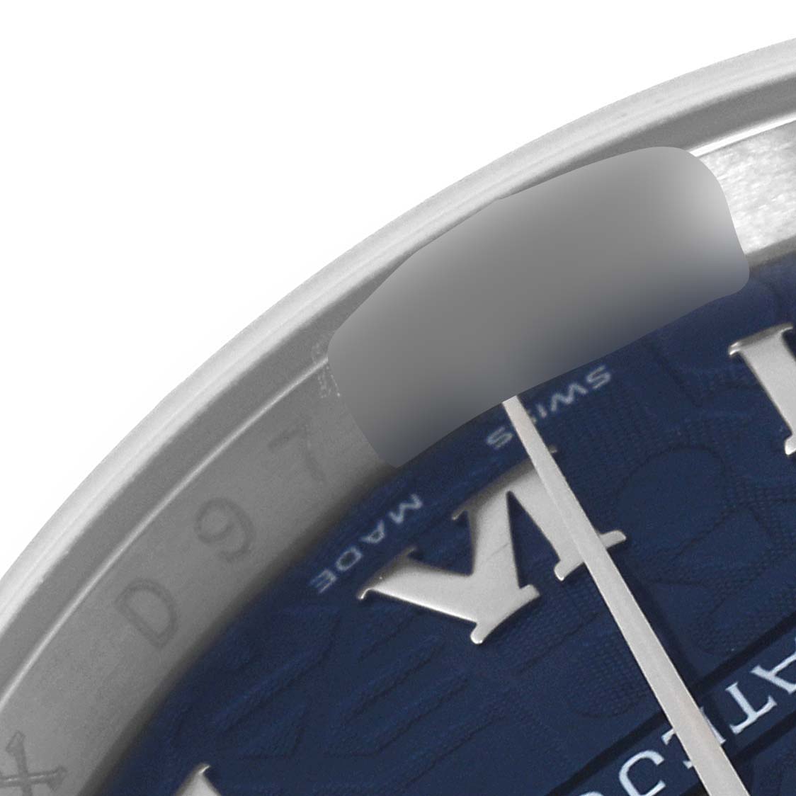 This close-up view shows the edge of the dial and part of the bezel of a Rolex Datejust 116234 Men's Stainless Steel Blue Dial 116234 Men's Stainless Steel Blue Dial watch.
