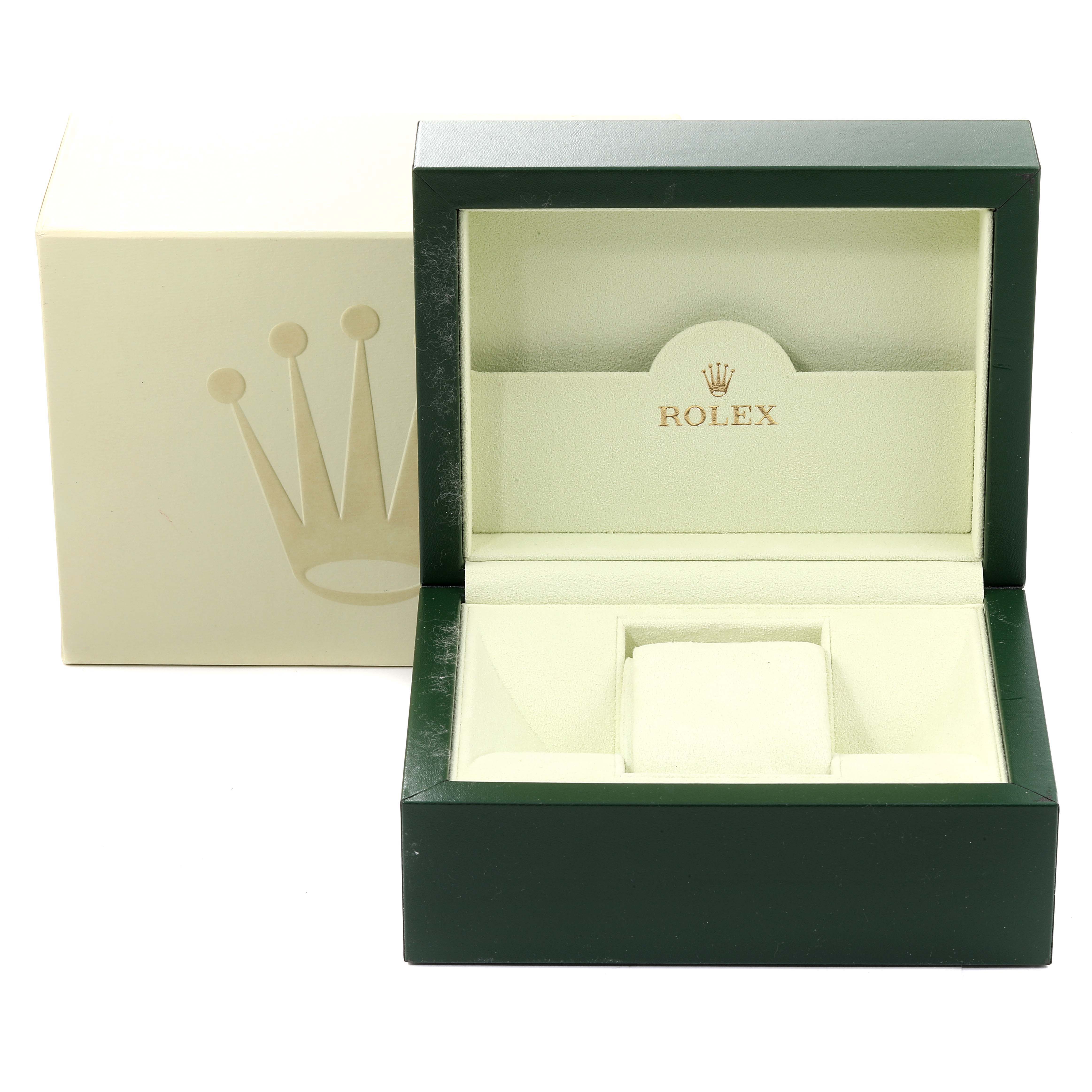 The image shows an open Rolex Datejust 116234 Men's Stainless Steel Blue Dial 116234 Men's Stainless Steel Blue Dial watch box with a green exterior and beige interior.