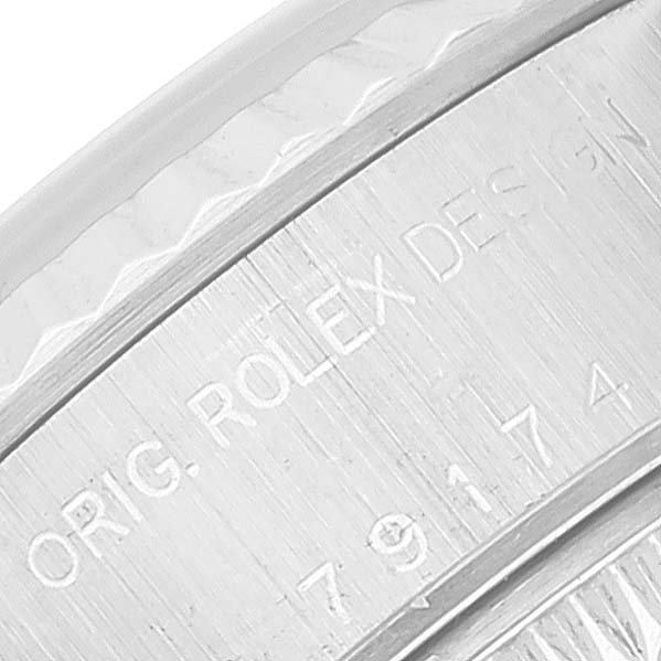 This image shows a close-up of the engraved text on the bezel of a Rolex Datejust 79174 Women's Stainless Steel Mother of Pearl Dial 79174 Women's Stainless Steel Mother of Pearl Dial watch.