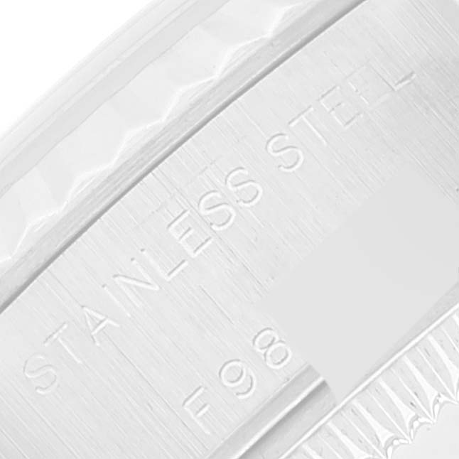 The image shows a close-up of the side of a Datejust model by Rolex, highlighting the "STAINLESS STEEL" engraving.