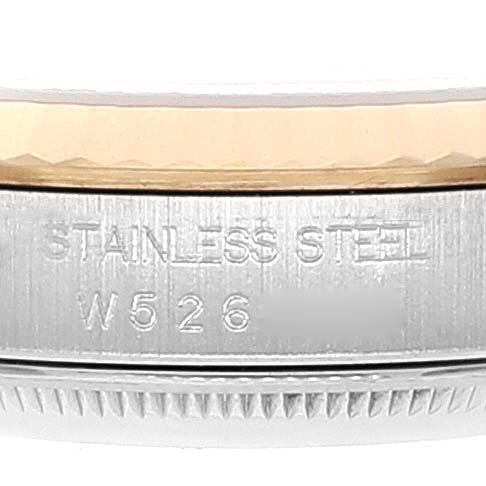 The image shows a close-up of the side of a Rolex Datejust 16233 Men
s Steel and Gold (two tone) Black Dial 16233 Men
s Steel and Gold (two tone) Black Dial watch, displaying "Stainless Steel" and a serial number.