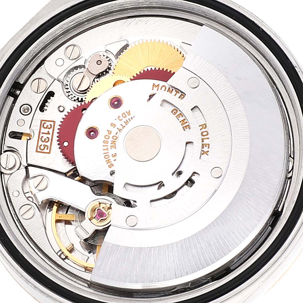 This image shows the internal mechanical movement of a Rolex Datejust 16233 Men
s Steel and Gold (two tone) Black Dial 16233 Men
s Steel and Gold (two tone) Black Dial watch from an aerial view.