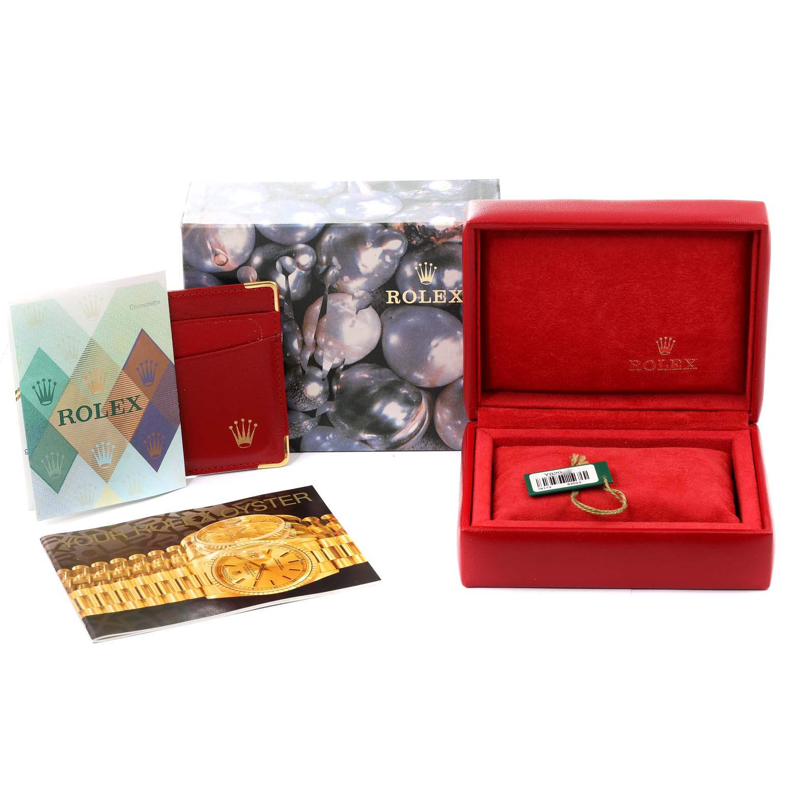 The image shows packaging and accessories for the Rolex Datejust 79173 Women
s Steel and Gold (two tone) Champagne Dial 79173 Women
s Steel and Gold (two tone) Champagne Dial model, including a box, booklets, and tags.
