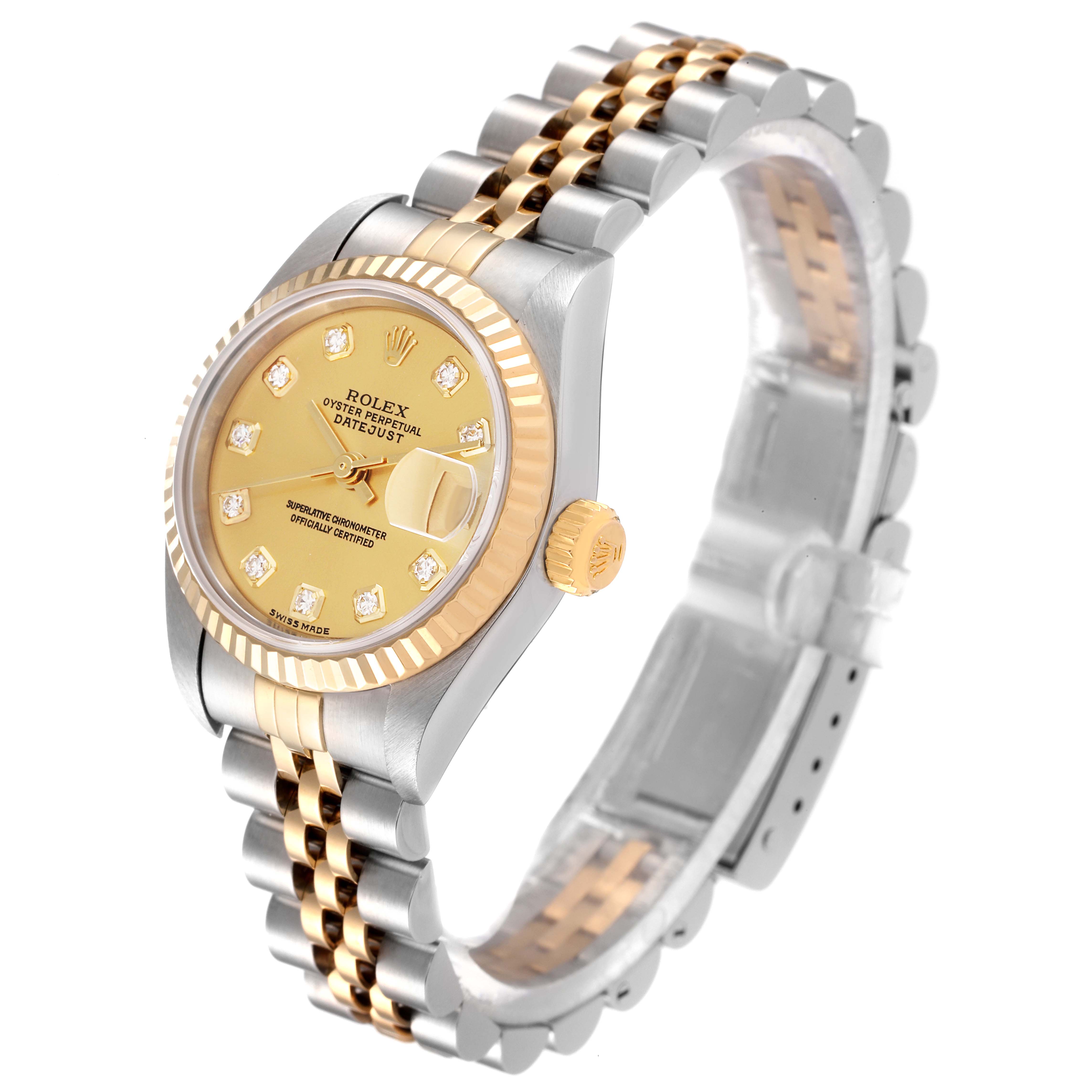 The image shows a Rolex Datejust 79173 Women
s Steel and Gold (two tone) Champagne Dial 79173 Women
s Steel and Gold (two tone) Champagne Dial watch at a slight angle, highlighting its gold dial, fluted bezel, and Jubilee bracelet.